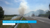 Rook bermbrand trekt over Deltaweg Goes